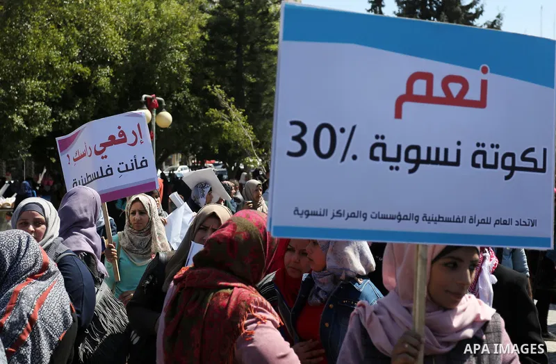 Palestinian women take part during a protest against violence towards women and demanding to end the Israeli occupation on International Women's Day, in Gaza city on March 08, 2017. Photo by Ashraf Amra