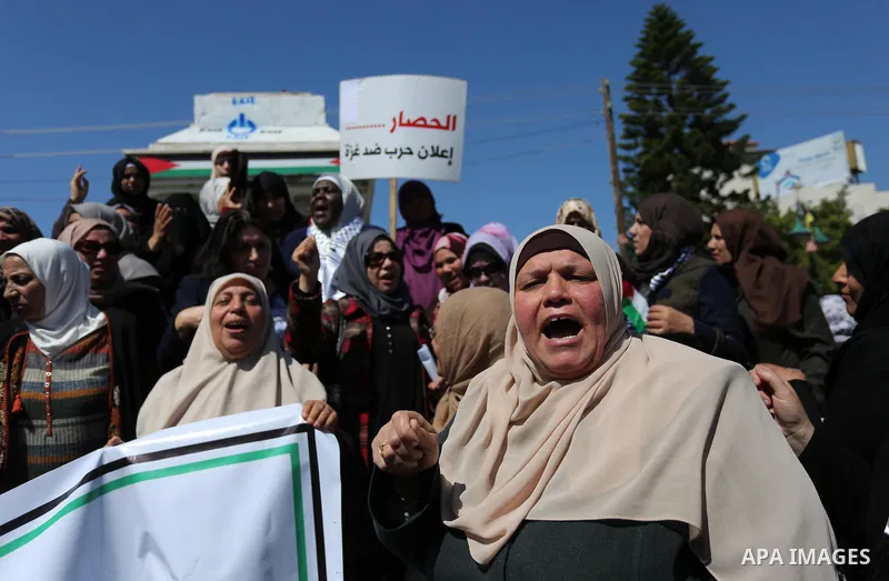 Palestinian women take part during a protest against violence towards women and demanding to end the Israeli occupation on International Women's Day, in Gaza city on March 08, 2017. Photo by Ashraf Amra