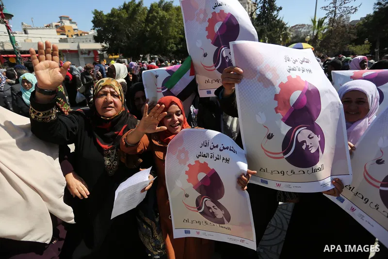 Palestinian women take part during a protest against violence towards women and demanding to end the Israeli occupation on International Women's Day, in Gaza city on March 08, 2017. Photo by Ashraf Amra