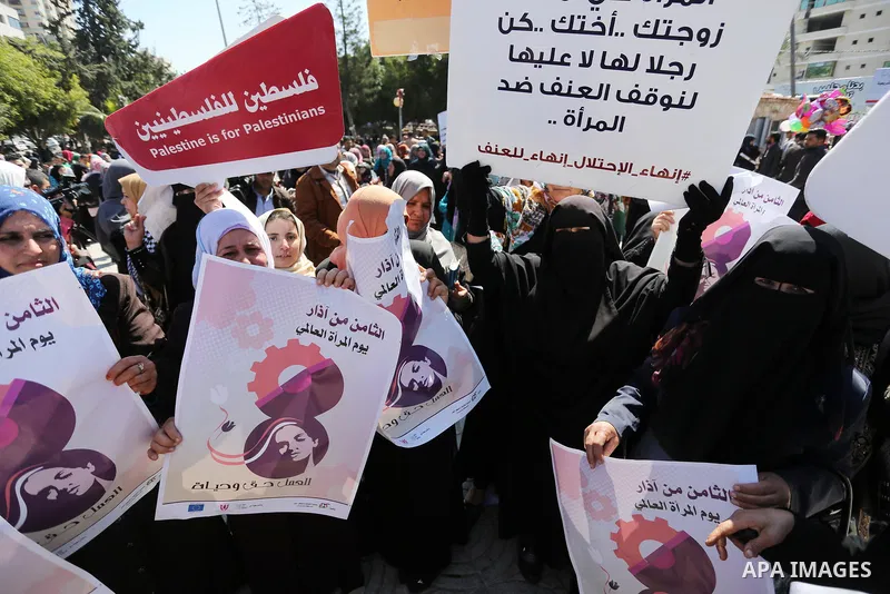 Palestinian women take part during a protest against violence towards women and demanding to end the Israeli occupation on International Women's Day, in Gaza city on March 08, 2017. Photo by Ashraf Amra