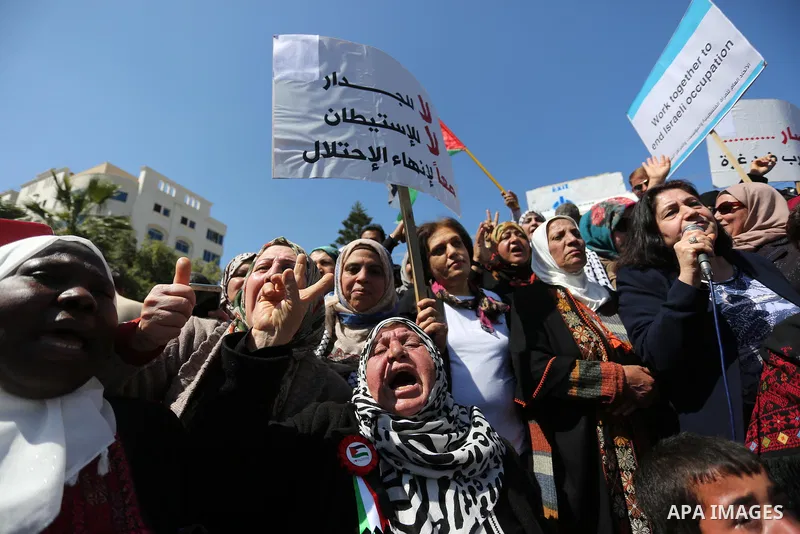 Palestinian women take part during a protest against violence towards women and demanding to end the Israeli occupation on International Women's Day, in Gaza city on March 08, 2017. Photo by Ashraf Amra