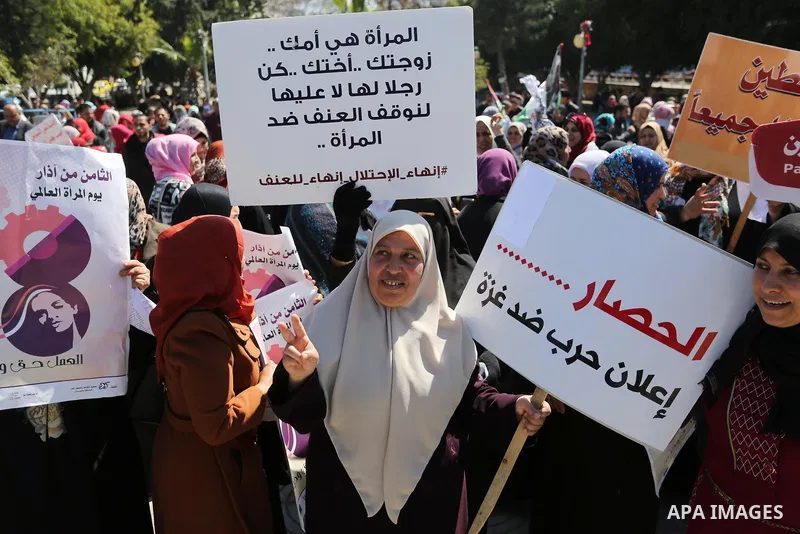 Palestinian women take part during a protest against violence towards women and demanding to end the Israeli occupation on International Women's Day, in Gaza city on March 08, 2017. Photo by Ashraf Amra