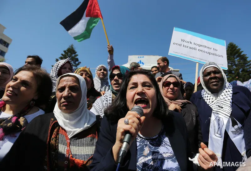 Palestinian women take part during a protest against violence towards women and demanding to end the Israeli occupation on International Women's Day, in Gaza city on March 08, 2017. Photo by Ashraf Amra