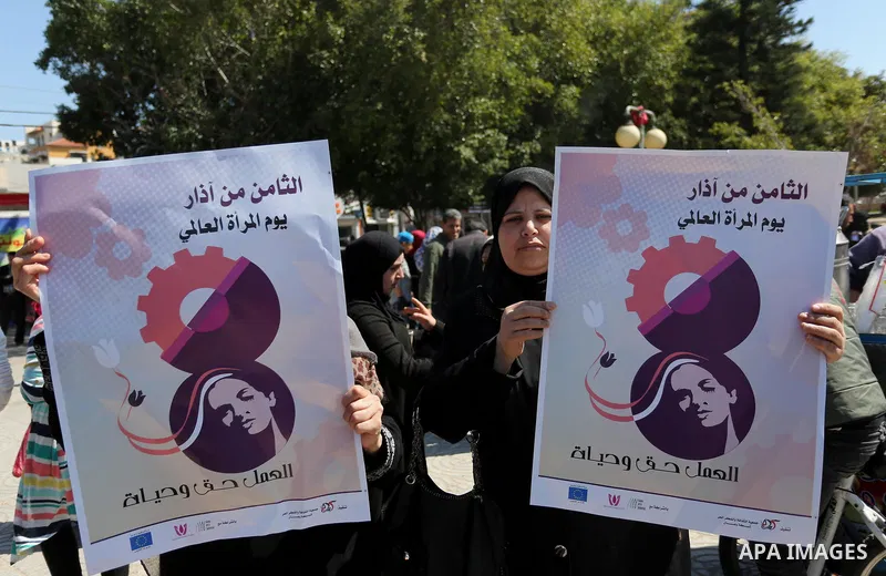 Palestinian women take part during a protest against violence towards women and demanding to end the Israeli occupation on International Women's Day, in Gaza city on March 08, 2017. Photo by Ashraf Amra