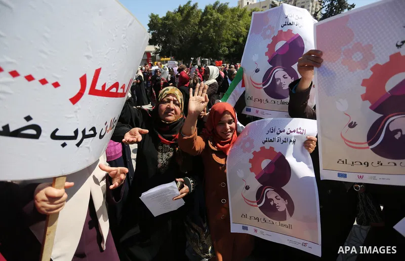 Palestinian women take part during a protest against violence towards women and demanding to end the Israeli occupation on International Women's Day, in Gaza city on March 08, 2017. Photo by Ashraf Amra