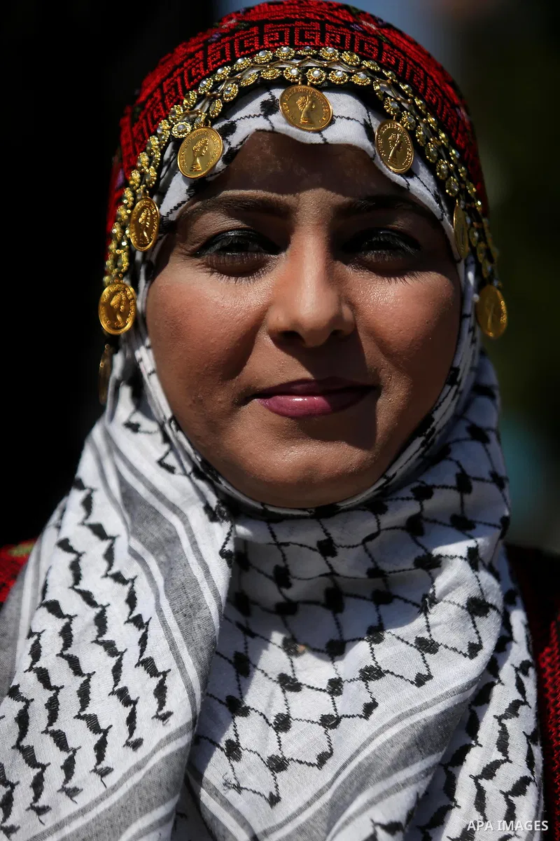 Palestinian women take part during a protest against violence towards women and demanding to end the Israeli occupation on International Women's Day, in Gaza city on March 08, 2017. Photo by Ashraf Amra