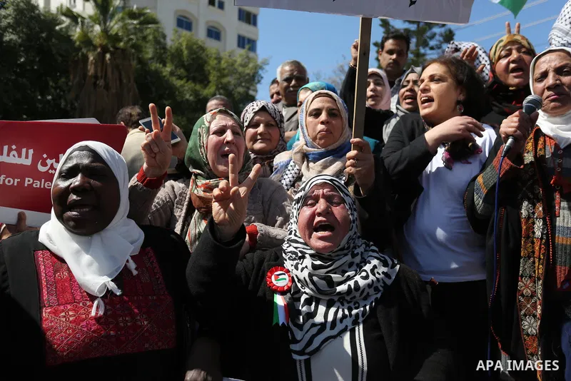 Palestinian women take part during a protest against violence towards women and demanding to end the Israeli occupation on International Women's Day, in Gaza city on March 08, 2017. Photo by Ashraf Amra