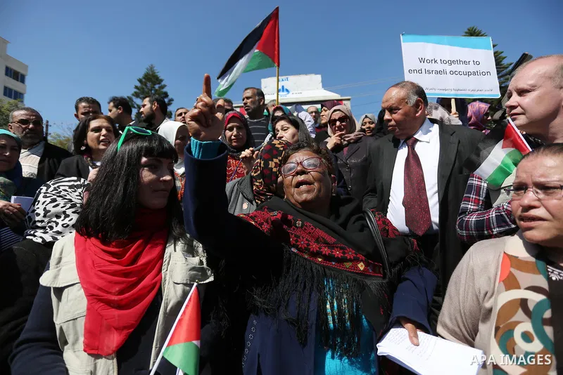 Palestinian women take part during a protest against violence towards women and demanding to end the Israeli occupation on International Women's Day, in Gaza city on March 08, 2017. Photo by Ashraf Amra