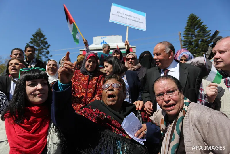 Palestinian women take part during a protest against violence towards women and demanding to end the Israeli occupation on International Women's Day, in Gaza city on March 08, 2017. Photo by Ashraf Amra