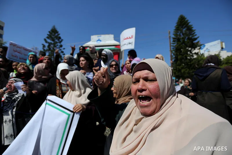 Palestinian women take part during a protest against violence towards women and demanding to end the Israeli occupation on International Women's Day, in Gaza city on March 08, 2017. Photo by Ashraf Amra