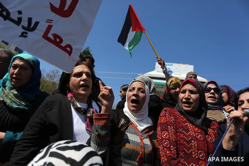Palestinian women take part during a protest against violence towards women and demanding to end the Israeli occupation on International Women's Day, in Gaza city on March 08, 2017. Photo by Ashraf Amra