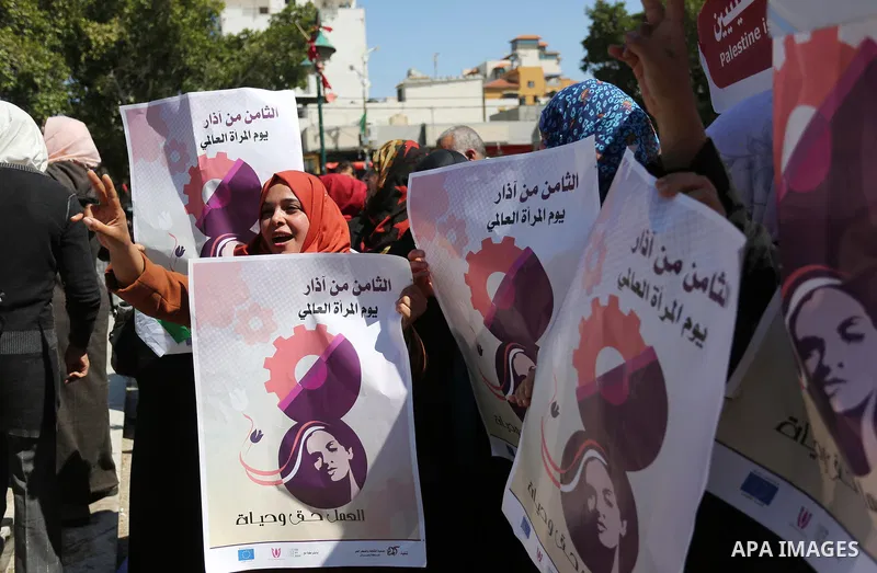 Palestinian women take part during a protest against violence towards women and demanding to end the Israeli occupation on International Women's Day, in Gaza city on March 08, 2017. Photo by Ashraf Amra