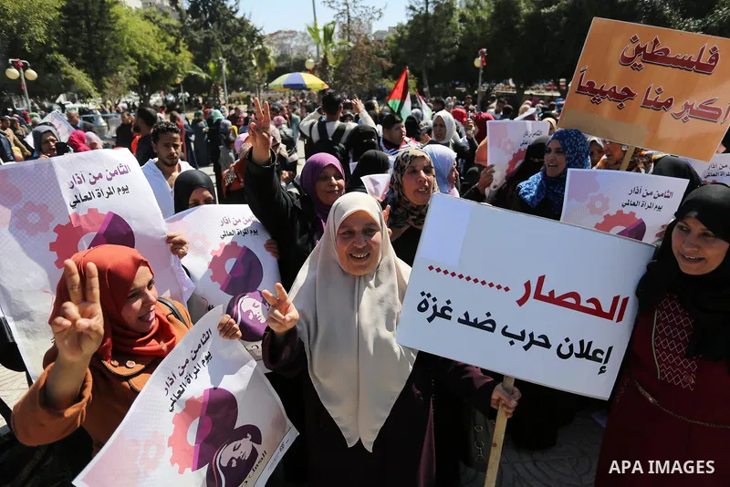 Palestinian women take part during a protest against violence towards women and demanding to end the Israeli occupation on International Women's Day, in Gaza city on March 08, 2017. Photo by Ashraf Amra