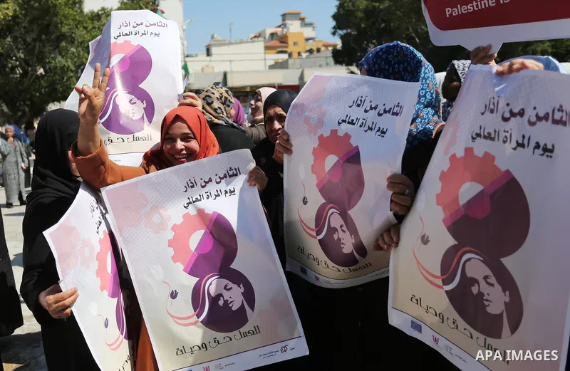 Palestinian women take part during a protest against violence towards women and demanding to end the Israeli occupation on International Women's Day, in Gaza city on March 08, 2017. Photo by Ashraf Amra