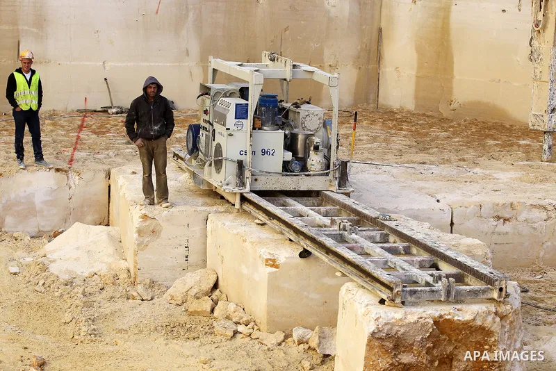Palestinian labourers work at a quarry in the West Bank village of Taffouh near Hebron, 08 March 2017. According to the Palestinian Union of Stone and Marble, the stone and marble sector is considered to be one of the mo...