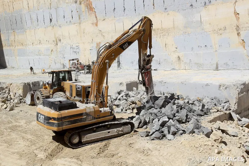 Palestinian labourers work at a quarry in the West Bank village of Taffouh near Hebron, 08 March 2017. According to the Palestinian Union of Stone and Marble, the stone and marble sector is considered to be one of the mo...