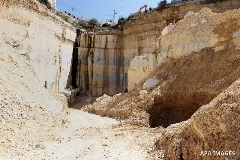 Palestinian labourers work at a quarry in the West Bank village of Taffouh near Hebron, 08 March 2017. According to the Palestinian Union of Stone and Marble, the stone and marble sector is considered to be one of the mo...