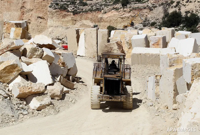 Palestinian labourers work at a quarry in the West Bank village of Taffouh near Hebron, 08 March 2017. According to the Palestinian Union of Stone and Marble, the stone and marble sector is considered to be one of the mo...