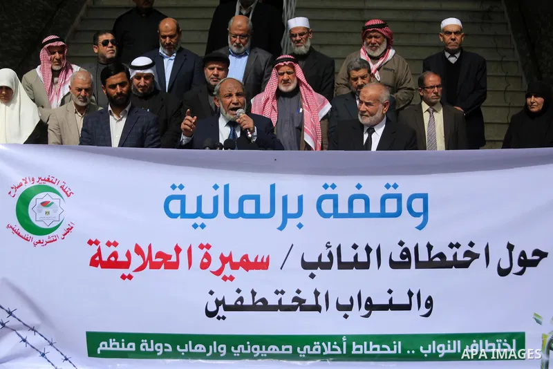 Palestinian Members of the Legislative council take part in a protest against arrest oh the Parliament deputy of Hamas, Samira Halaika, in Gaza city, on March 12, 2017. Photo by Ashraf Amra