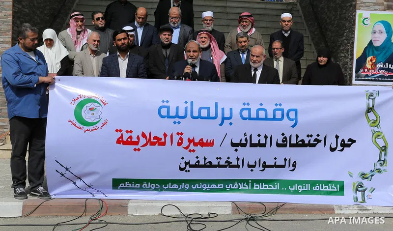 Palestinian Members of the Legislative council take part in a protest against arrest oh the Parliament deputy of Hamas, Samira Halaika, in Gaza city, on March 12, 2017. Photo by Ashraf Amra