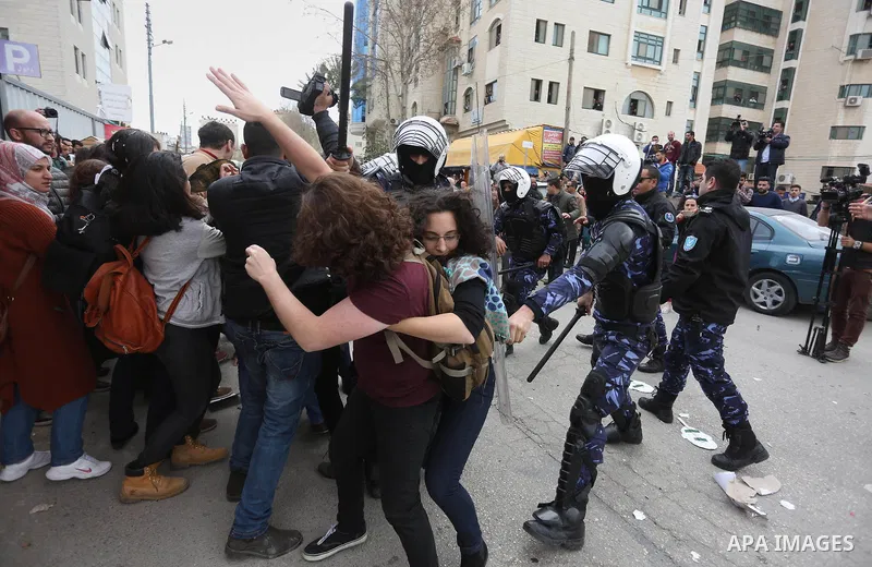 Protesters clash with Palestinian policemen following a demonstration against the trial of the martyr, Bassel al-Aaraj, in the West Bank city of Ramallah, on March 12, 2017. Photo by Stringer