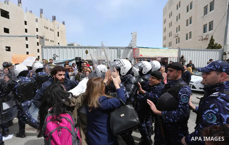 Protesters clash with Palestinian policemen following a demonstration against the trial of the martyr, Bassel al-Aaraj, in the West Bank city of Ramallah, on March 12, 2017. Photo by Stringer
