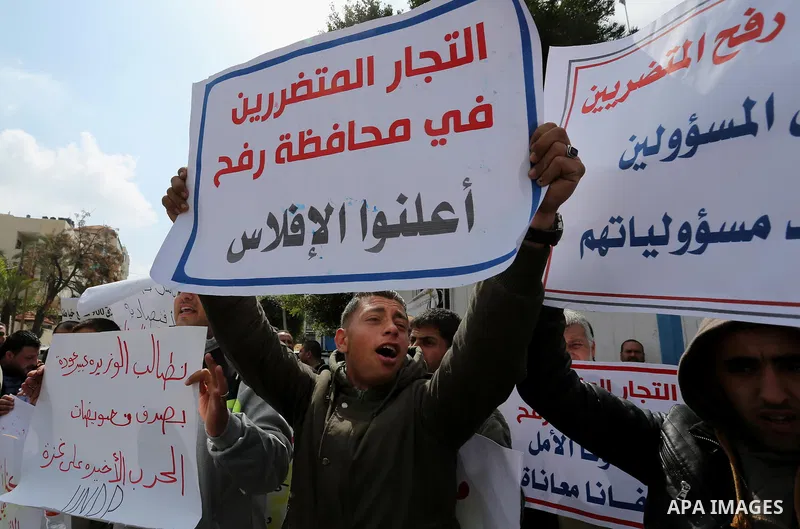 Palestinian factories owners demonstrate on March 13, 2017 outside the UN offices in Gaza City as their business were not yet rebuild since the 2014 war between Hamas militants and Israel. Photo by Ashraf Amra