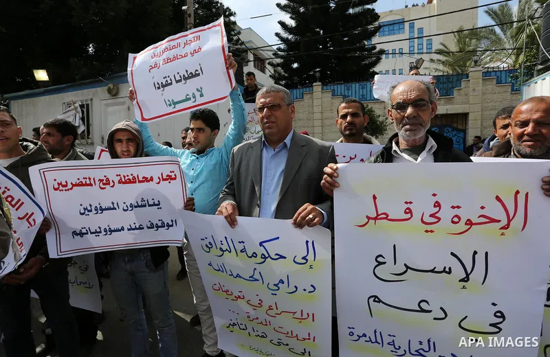 Palestinian factories owners demonstrate on March 13, 2017 outside the UN offices in Gaza City as their business were not yet rebuild since the 2014 war between Hamas militants and Israel. Photo by Ashraf Amra