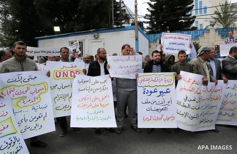 Palestinian factories owners demonstrate on March 13, 2017 outside the UN offices in Gaza City as their business were not yet rebuild since the 2014 war between Hamas militants and Israel. Photo by Ashraf Amra