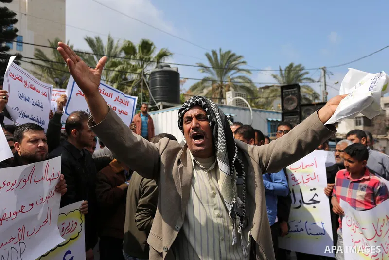 Palestinian factories owners demonstrate on March 13, 2017 outside the UN offices in Gaza City as their business were not yet rebuild since the 2014 war between Hamas militants and Israel. Photo by Ashraf Amra