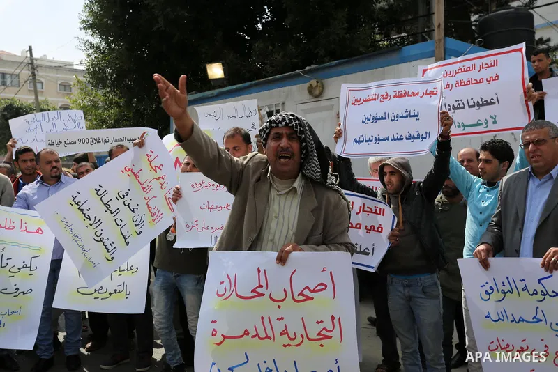 Palestinian factories owners demonstrate on March 13, 2017 outside the UN offices in Gaza City as their business were not yet rebuild since the 2014 war between Hamas militants and Israel. Photo by Ashraf Amra