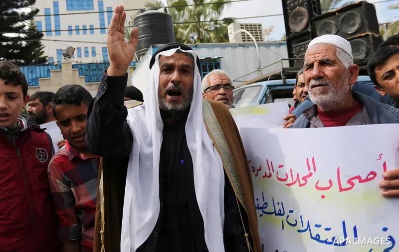 Palestinian factories owners demonstrate on March 13, 2017 outside the UN offices in Gaza City as their business were not yet rebuild since the 2014 war between Hamas militants and Israel. Photo by Ashraf Amra