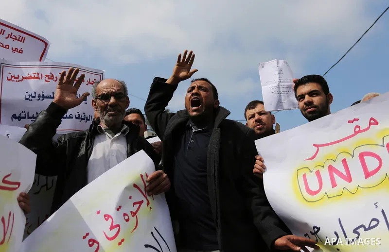 Palestinian factories owners demonstrate on March 13, 2017 outside the UN offices in Gaza City as their business were not yet rebuild since the 2014 war between Hamas militants and Israel. Photo by Ashraf Amra