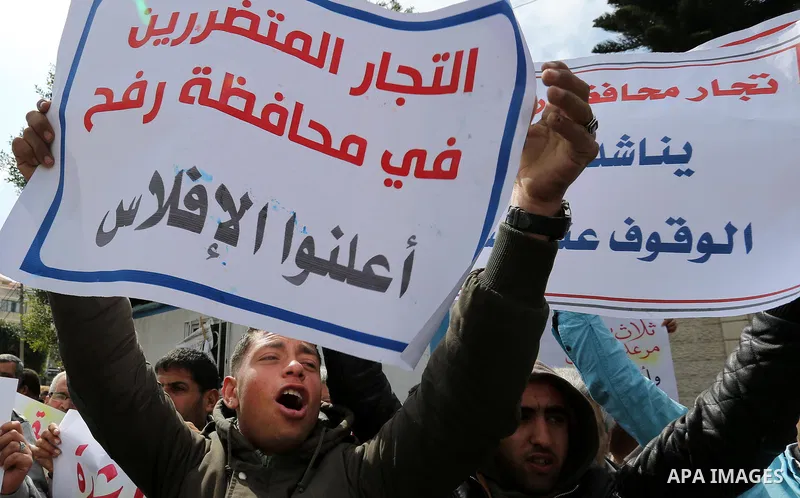 Palestinian factories owners demonstrate on March 13, 2017 outside the UN offices in Gaza City as their business were not yet rebuild since the 2014 war between Hamas militants and Israel. Photo by Ashraf Amra