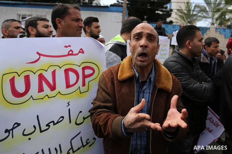 Palestinian factories owners demonstrate on March 13, 2017 outside the UN offices in Gaza City as their business were not yet rebuild since the 2014 war between Hamas militants and Israel. Photo by Ashraf Amra