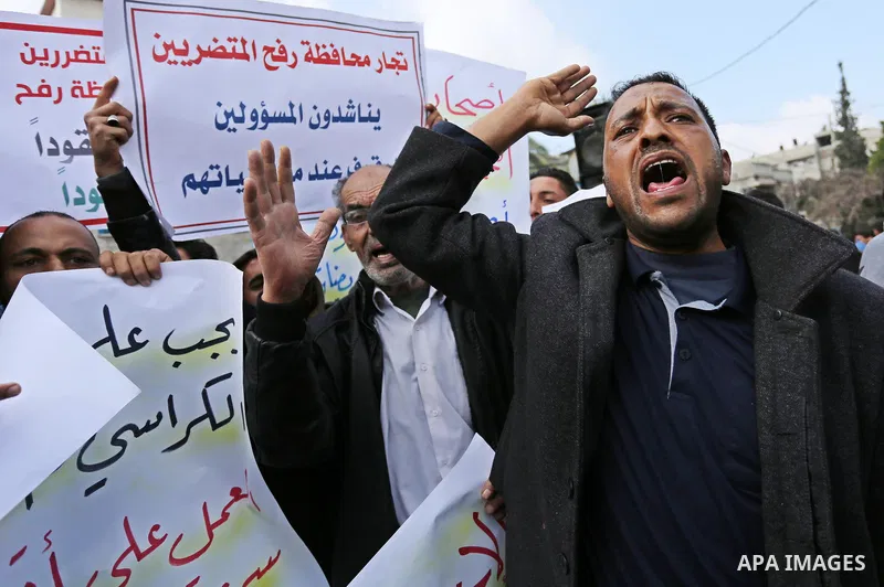 Palestinian factories owners demonstrate on March 13, 2017 outside the UN offices in Gaza City as their business were not yet rebuild since the 2014 war between Hamas militants and Israel. Photo by Ashraf Amra