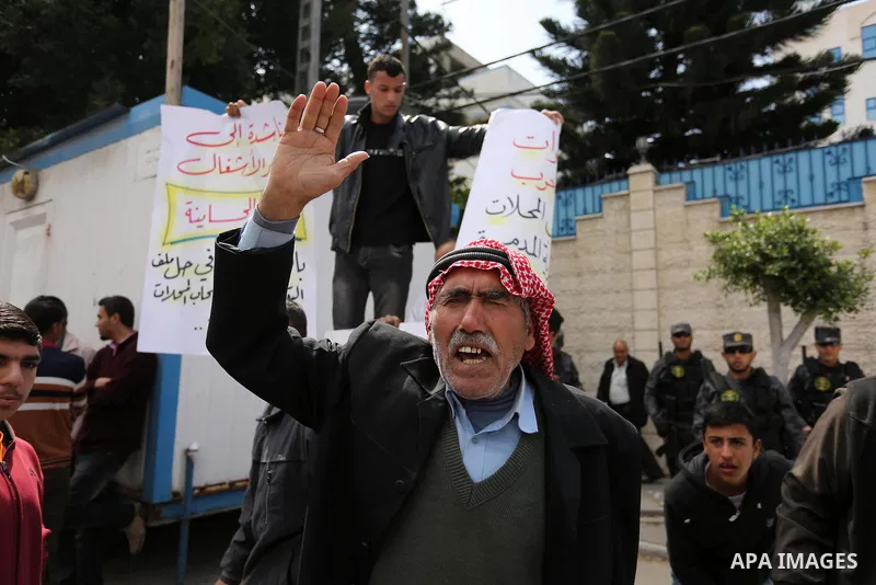 Palestinian factories owners demonstrate on March 13, 2017 outside the UN offices in Gaza City as their business were not yet rebuild since the 2014 war between Hamas militants and Israel. Photo by Ashraf Amra