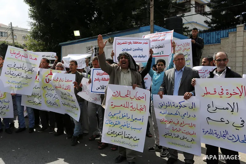 Palestinian factories owners demonstrate on March 13, 2017 outside the UN offices in Gaza City as their business were not yet rebuild since the 2014 war between Hamas militants and Israel. Photo by Ashraf Amra