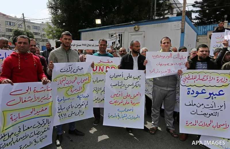 Palestinian factories owners demonstrate on March 13, 2017 outside the UN offices in Gaza City as their business were not yet rebuild since the 2014 war between Hamas militants and Israel. Photo by Ashraf Amra