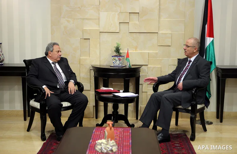 Palestinian Prime Minister Rami Hamdallah meets with Constitutional Court Chairman Mohammed Alhaji Qasim, in the West Bank city of Ramallah, on March 13, 2017. Photo by Prime Minister Office