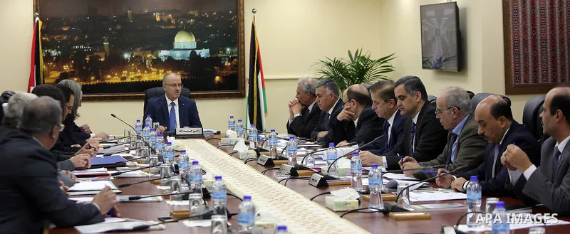 Palestinian Prime Minister Rami hamdallah heads the Palestinian cabinet meeting in the West Bank city of Ramallah on March . 14.2017. Photo by Prime Minister Office