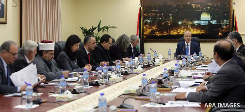 Palestinian Prime Minister Rami hamdallah heads the Palestinian cabinet meeting in the West Bank city of Ramallah on March . 14.2017. Photo by Prime Minister Office