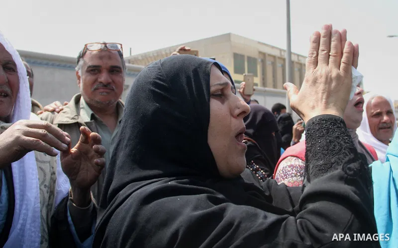 Released detainees wave to their relatives after Egyptian President Abdel Fattah al-Sisi issued a pardon for 203 youths jailed for taking part in demonstrations, as part of a pledge he made months ago to amend a protest...
