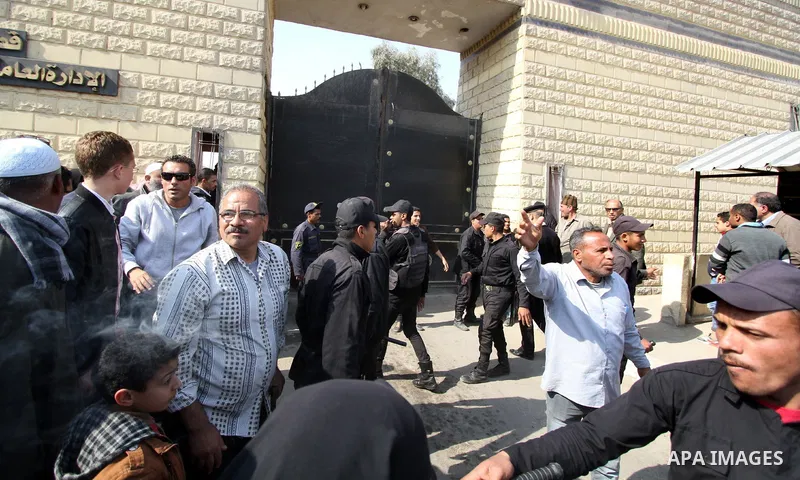 Released detainees wave to their relatives after Egyptian President Abdel Fattah al-Sisi issued a pardon for 203 youths jailed for taking part in demonstrations, as part of a pledge he made months ago to amend a protest...