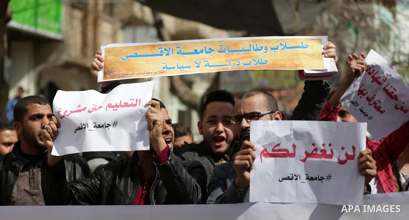 Palestinian students from the Al-Aqsa University, take part in a protest to demand their rights, in Gaza city, on March 15, 2017. Photo by Ashraf Amra