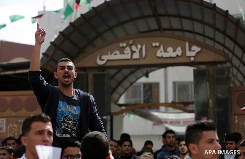 Palestinian students from the Al-Aqsa University, take part in a protest to demand their rights, in Gaza city, on March 15, 2017. Photo by Ashraf Amra