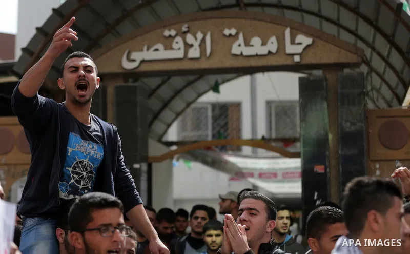 Palestinian students from the Al-Aqsa University, take part in a protest to demand their rights, in Gaza city, on March 15, 2017. Photo by Ashraf Amra