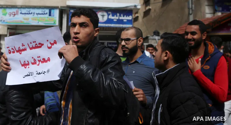 Palestinian students from the Al-Aqsa University, take part in a protest to demand their rights, in Gaza city, on March 15, 2017. Photo by Ashraf Amra