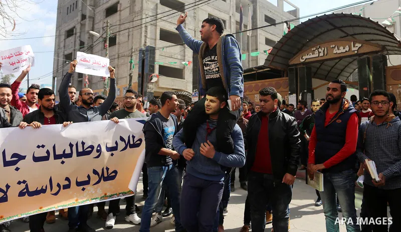 Palestinian students from the Al-Aqsa University, take part in a protest to demand their rights, in Gaza city, on March 15, 2017. Photo by Ashraf Amra