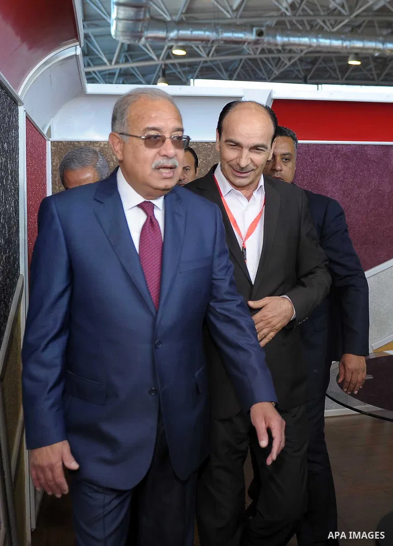 Egyptian Prime Minister Ismail Sharif attends Cairo International exposition, in Cairo, Egypt, on March 15, 2017. Photo by Stringer
